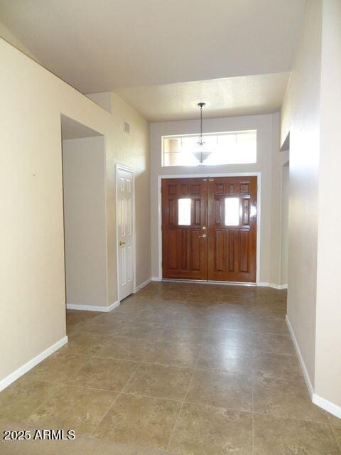 entryway featuring baseboards