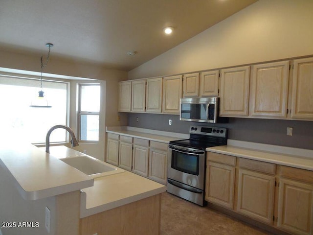 kitchen with a sink, light countertops, light brown cabinets, and stainless steel appliances