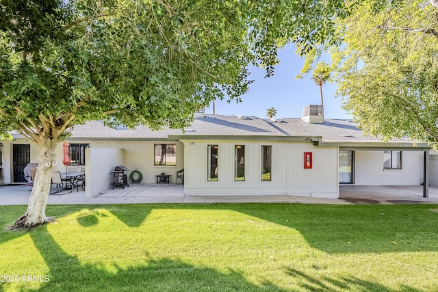 back of house with a lawn, central AC, and a patio area