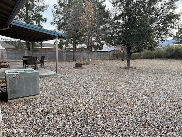 view of yard featuring cooling unit and a patio area