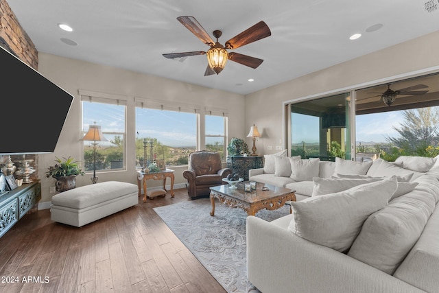 living room featuring hardwood / wood-style flooring and ceiling fan