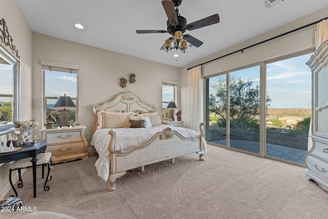 bedroom with access to exterior, ceiling fan, and carpet flooring