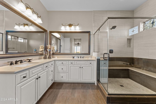 bathroom with vanity and an enclosed shower