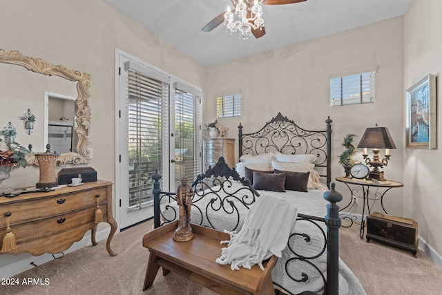 bedroom featuring ceiling fan, access to exterior, and light carpet