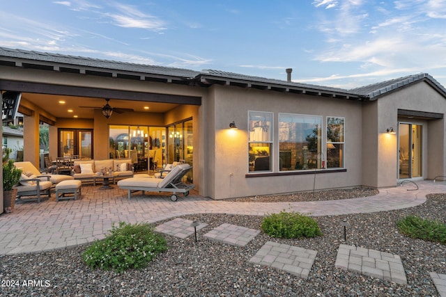 rear view of house with a patio area, outdoor lounge area, and ceiling fan