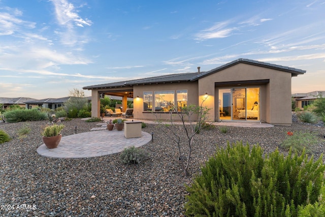 back of house with a patio area