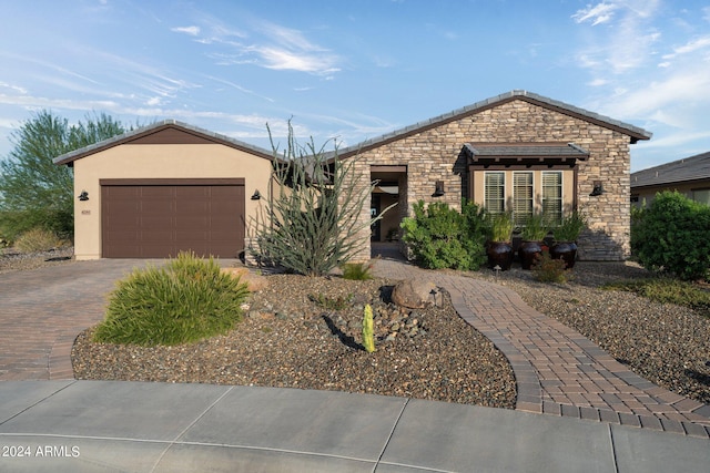 ranch-style house featuring a garage