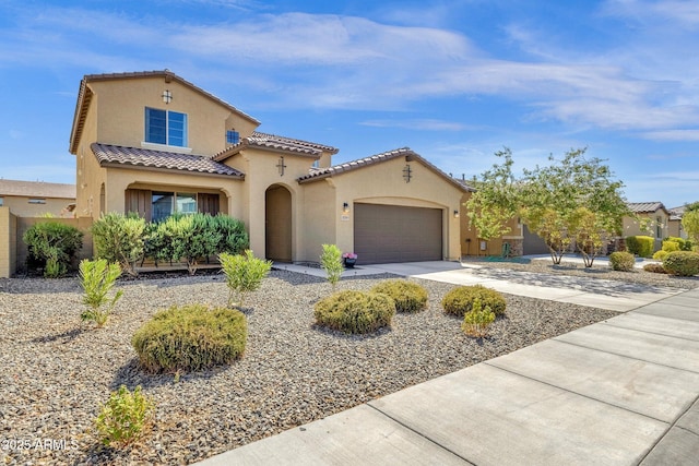 mediterranean / spanish-style home featuring a garage