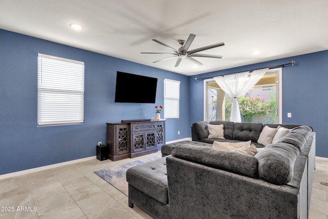 living room with light tile patterned floors and ceiling fan