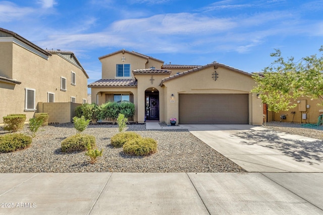 mediterranean / spanish-style home featuring a garage