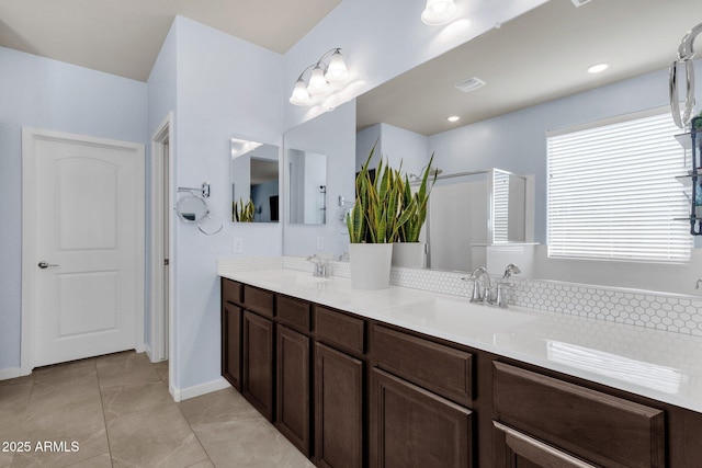 bathroom with tile patterned flooring and vanity