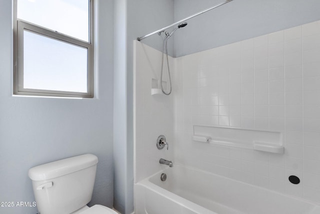 bathroom featuring  shower combination and toilet