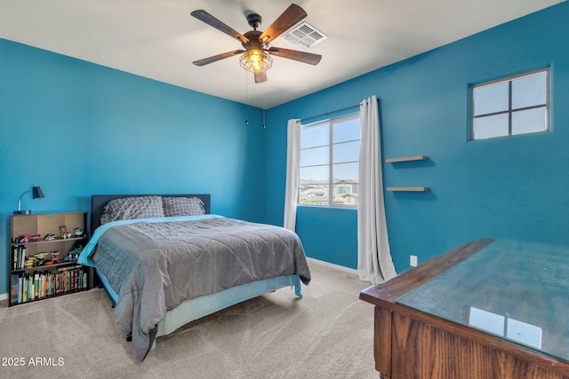 bedroom featuring light colored carpet and ceiling fan