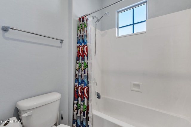 bathroom featuring shower / bath combo and toilet