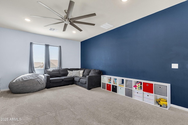 living room featuring ceiling fan and carpet floors