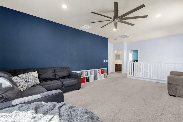 carpeted living room featuring ceiling fan