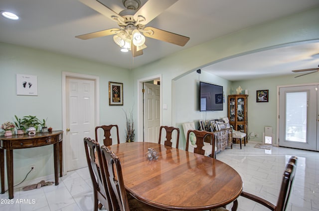 dining room featuring ceiling fan