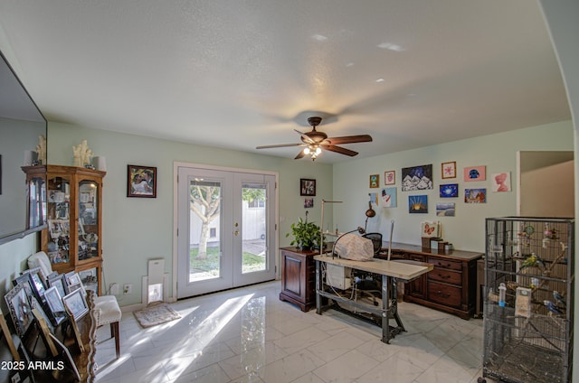 office with french doors and ceiling fan