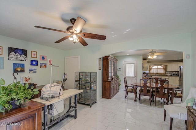 interior space featuring ceiling fan