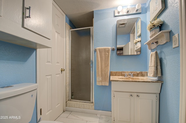 bathroom with vanity, an enclosed shower, and toilet