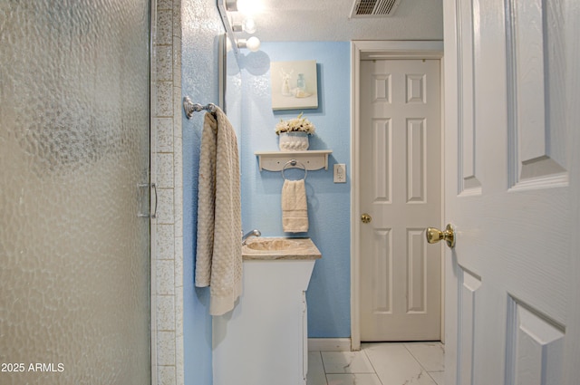 bathroom with a shower with shower door