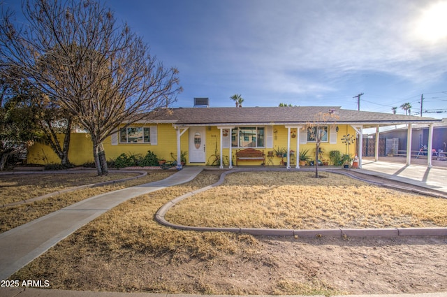 ranch-style house with a carport