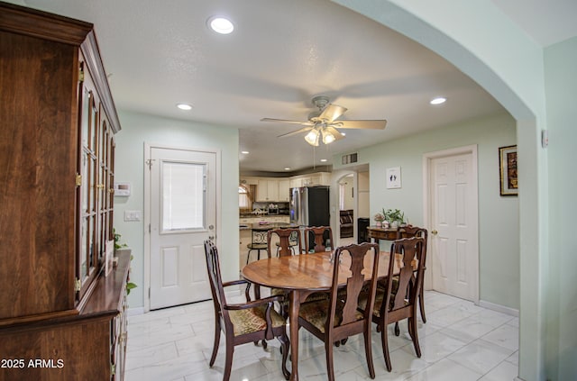 dining space with ceiling fan