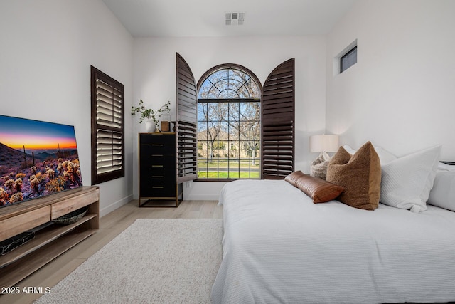 bedroom with light wood-type flooring