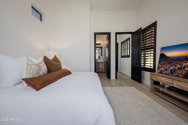 bedroom with light hardwood / wood-style flooring