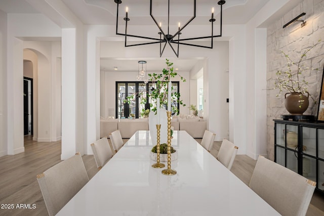 dining area featuring light wood-type flooring