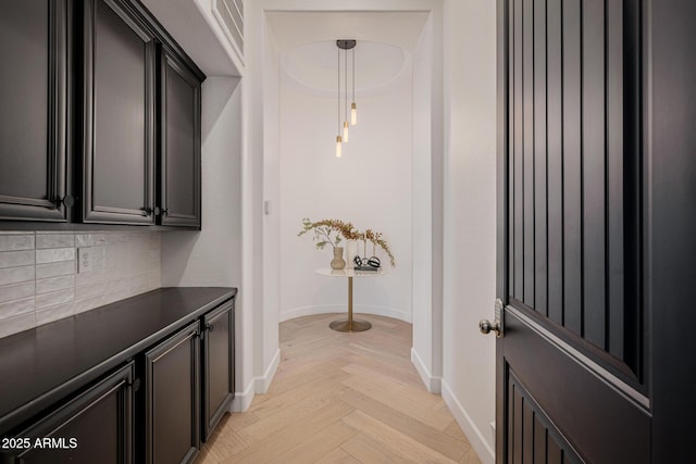 corridor with light parquet floors