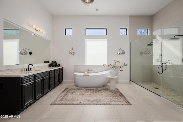 bathroom with tile patterned flooring, vanity, and plus walk in shower