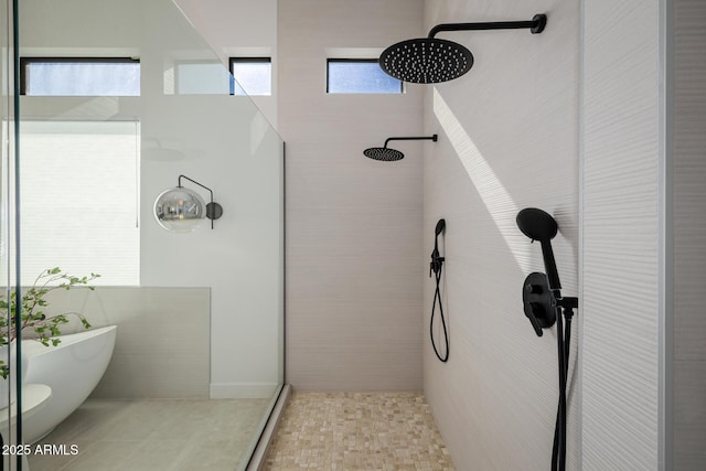 bathroom with shower with separate bathtub