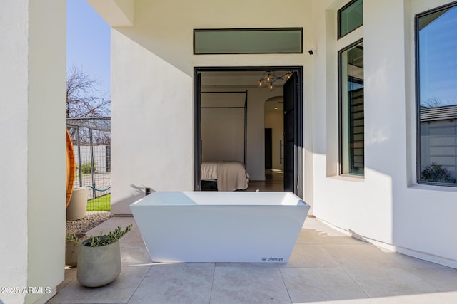 doorway to property featuring a patio area