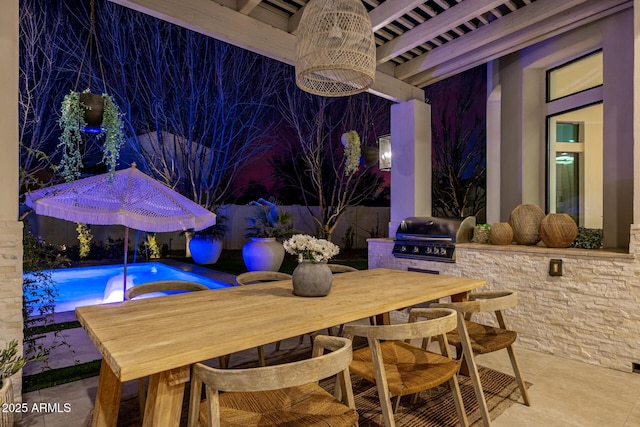 view of patio with an outdoor kitchen and a grill