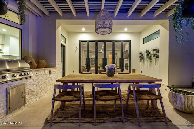 dining space with beam ceiling