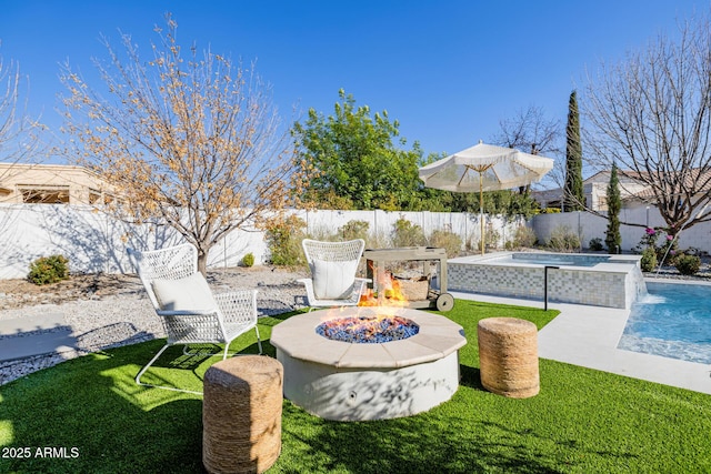 view of yard with pool water feature, a fire pit, and a fenced in pool