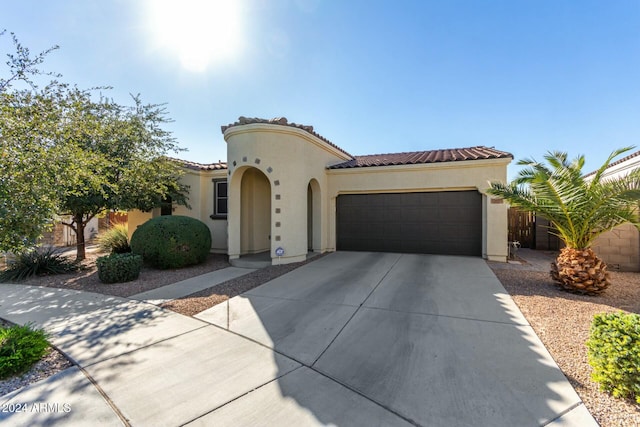 mediterranean / spanish-style house featuring a garage