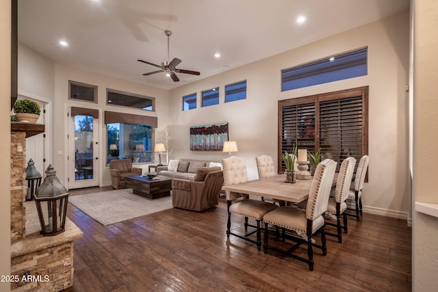 dining space featuring dark wood-type flooring and ceiling fan