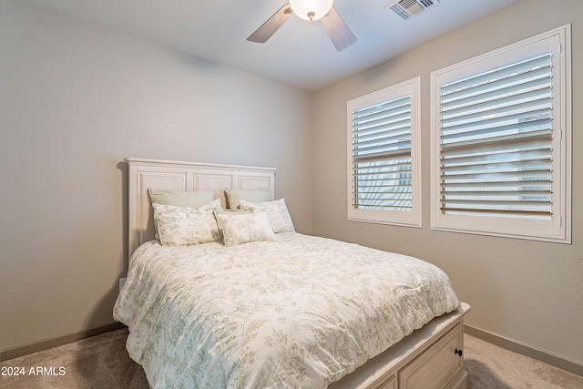 carpeted bedroom with ceiling fan