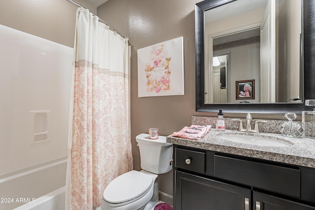 full bathroom with vanity, toilet, and shower / tub combo with curtain