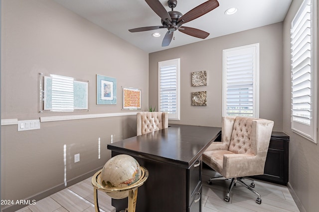 office with ceiling fan and light hardwood / wood-style floors