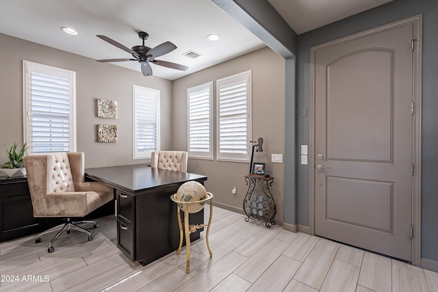 office space featuring light hardwood / wood-style floors and ceiling fan