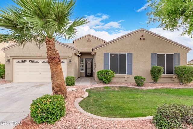 139 E Gail Dr, Gilbert, AZ 85296 - mediterranean / spanish-style home featuring an attached garage, driveway, stucco siding, a front yard, and a tile roof