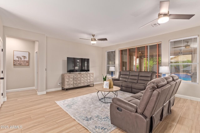 139 E Gail Dr, Gilbert, AZ 85296 - living room with a ceiling fan, light wood-style floors, and baseboards