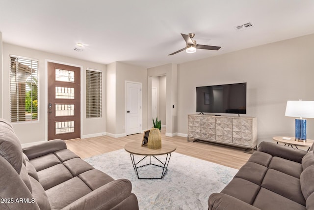 139 E Gail Dr, Gilbert, AZ 85296 - living room with wood finished floors, ceiling fan, and baseboards