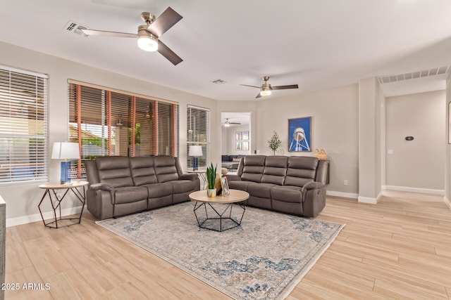 139 E Gail Dr, Gilbert, AZ 85296 - living room with a ceiling fan, baseboards, and light wood-style floors