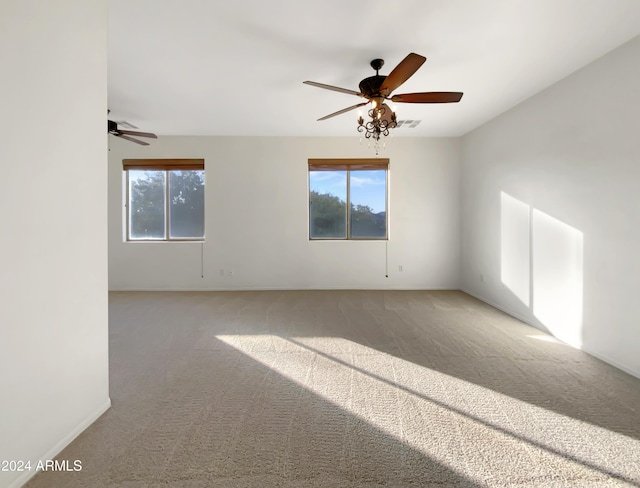 spare room with carpet floors and a wealth of natural light