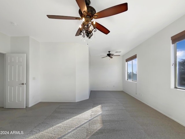 spare room featuring carpet floors and ceiling fan