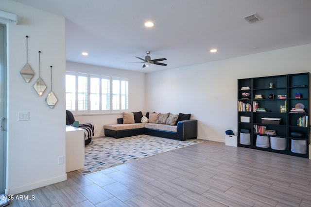 2727 N Acacia Way, Buckeye, AZ 85396 - living area featuring a ceiling fan, recessed lighting, wood finished floors, and baseboards